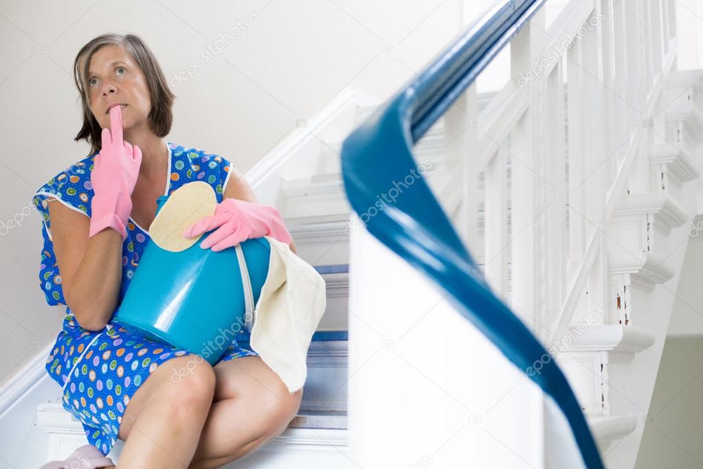 cleaning lady sitting on stairs