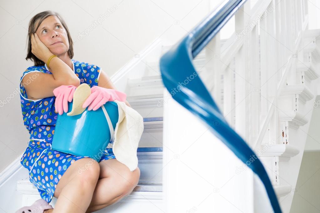 cleaning lady sitting on stairs