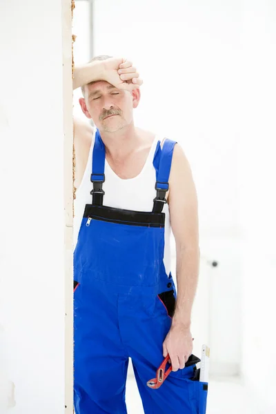 Tired handyman — Stock Photo, Image