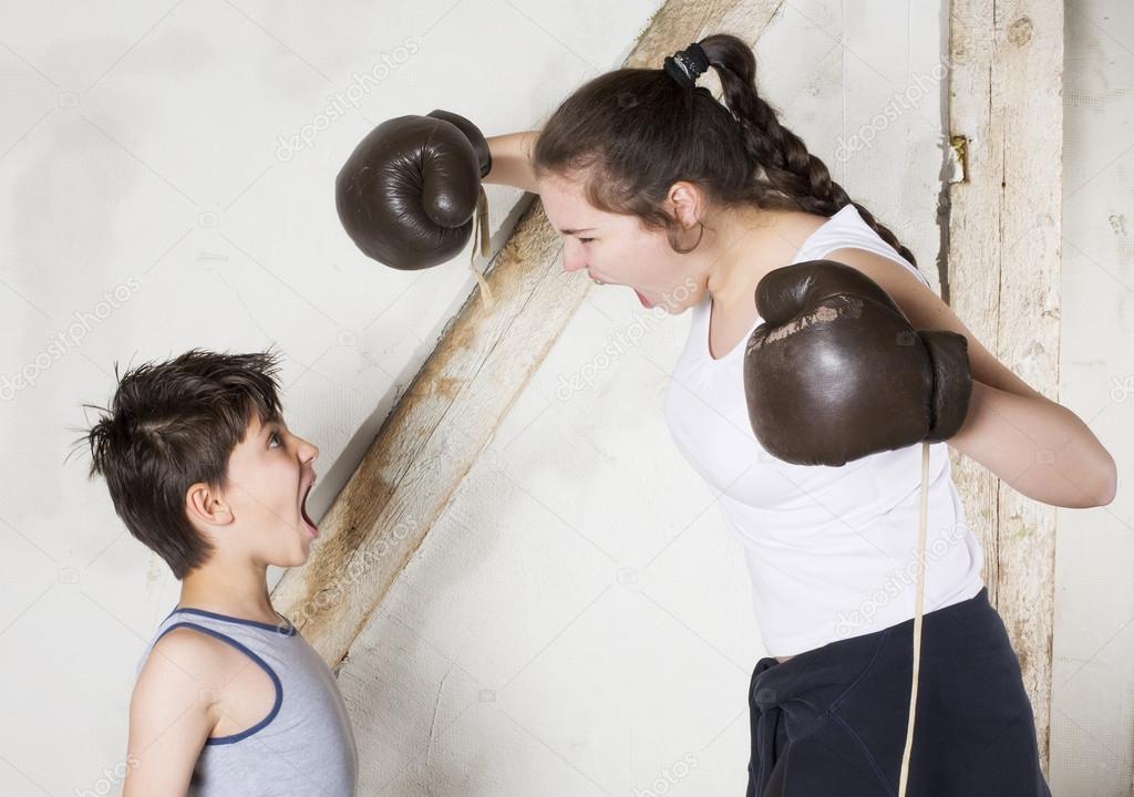 Boy and girl boxing