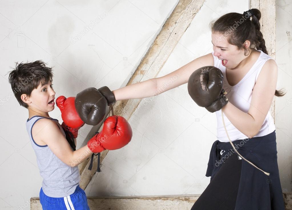 Boy and girl boxing