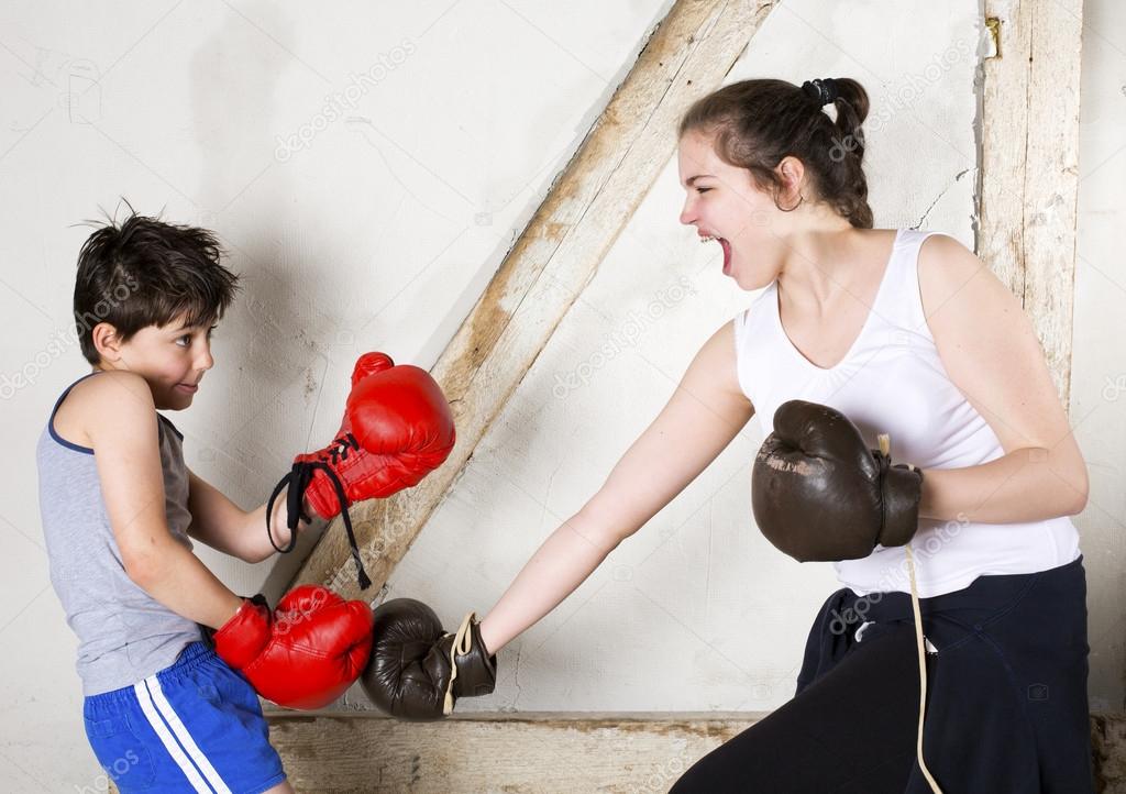 Boy and girl boxing