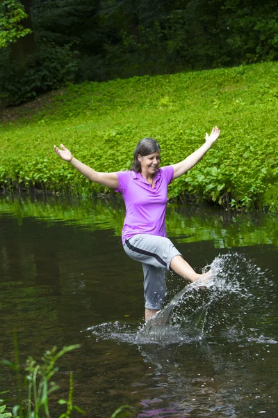 woman dancing in water