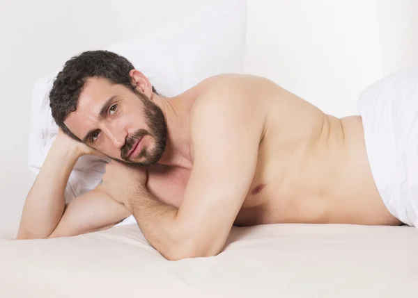 Man in bed — Stock Photo, Image