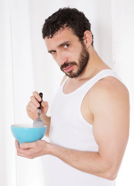 Man eating cereal — Stock Photo, Image