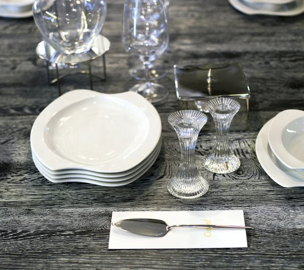 Table with plates and glasses — Stock Photo, Image