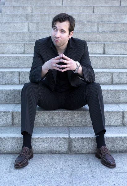 Businessman sitting on stairs — Stock Photo, Image