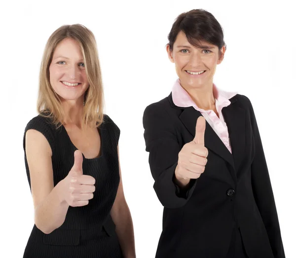Две предпринимательницы держат большие пальцы вверх — стоковое фото