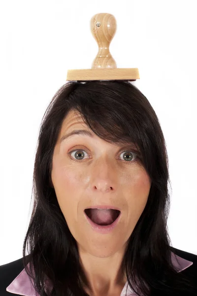 Woman with rubber stamp on her head — Stock Photo, Image