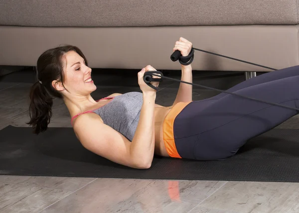 Woman exercising at home — Stock Photo, Image