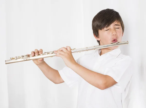 Мальчик с флейтой — стоковое фото