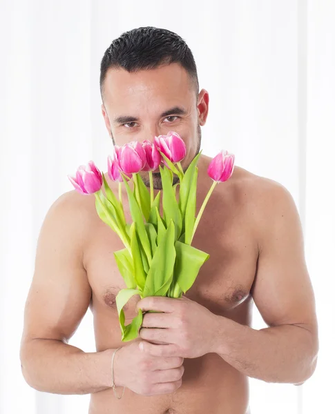Uomo con fiori — Foto Stock