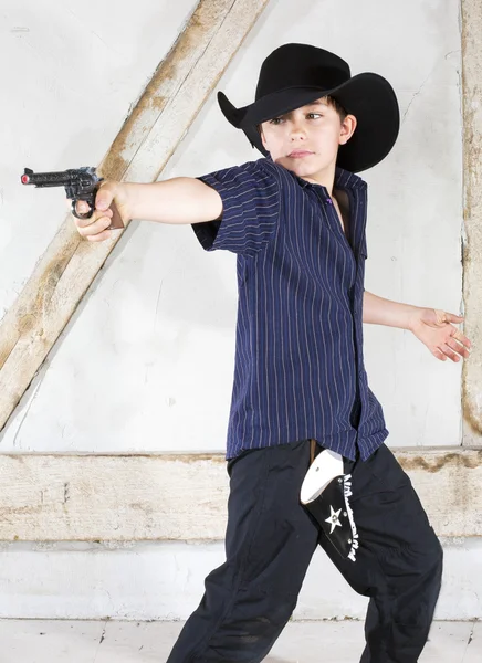 Jovem menino como um cowboy — Fotografia de Stock