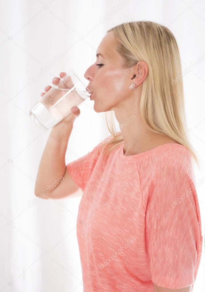 blond woman drinking water