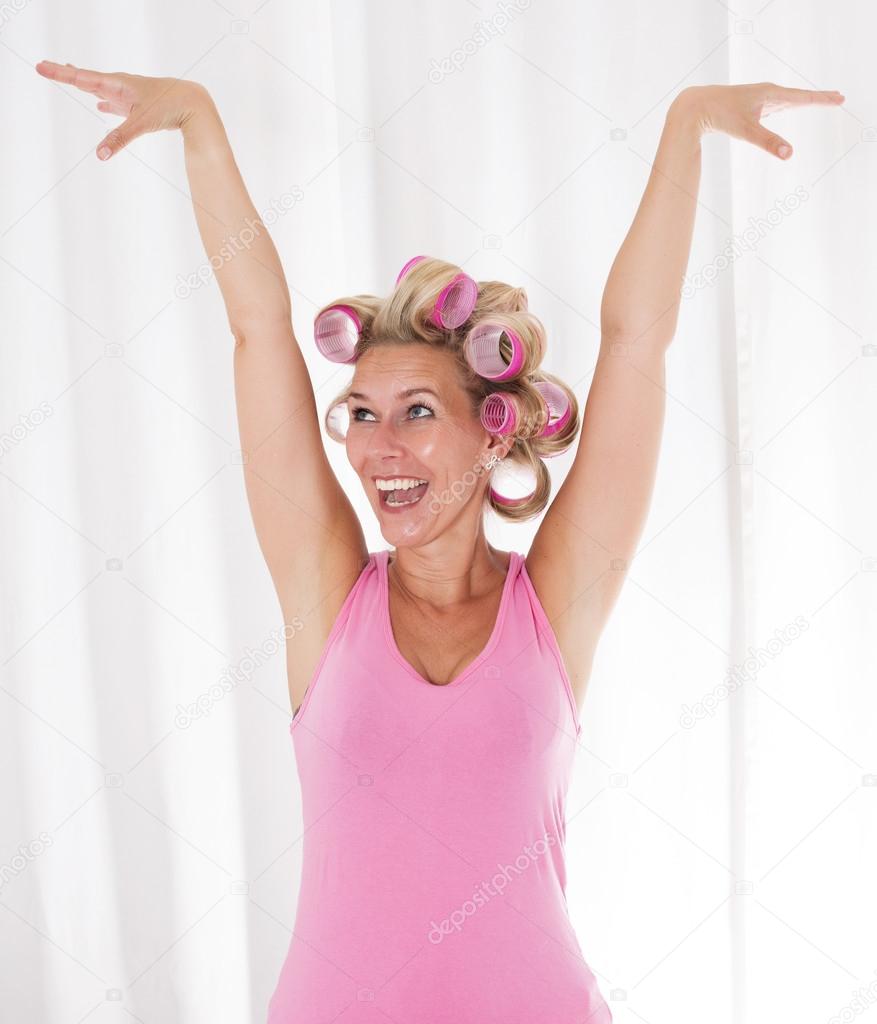 woman with pink curlers