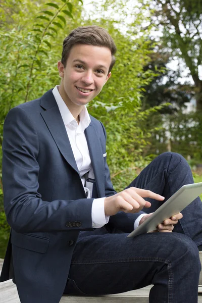 Young man with tablet — Stock Photo, Image