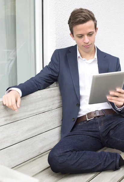 Young man with tablet — Stock Photo, Image