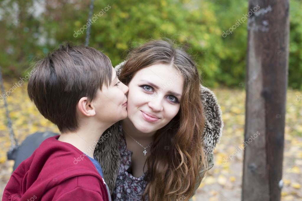 Boy kissing teenage girl on her cheek пїЅ Stock Photo #5 pic picture