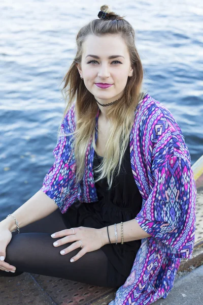 Young woman by the waterfront — Stock Photo, Image