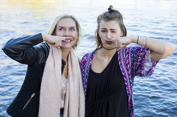 Two women with a painted mustache — Stock Photo, Image