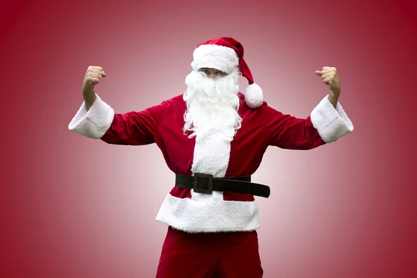Babbo Natale flettendo i muscoli — Foto Stock