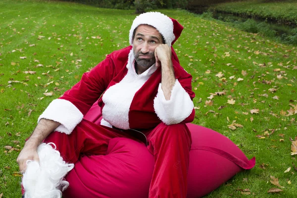 Santa claus in the park with his sack — Stock Photo, Image