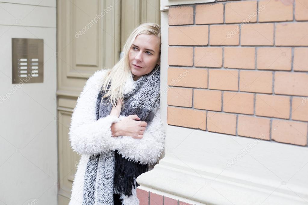 woman standing at a door