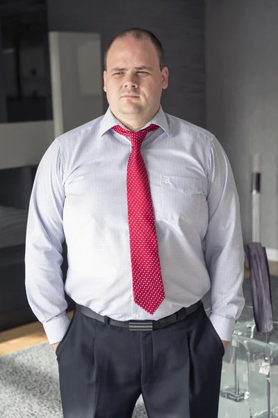 Businessman standing and looking thoughtful — Stock Photo, Image