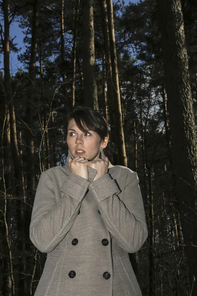 woman scared in forest