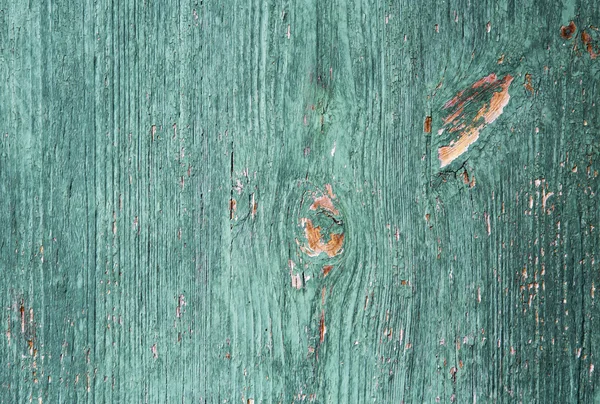 Piece of wood with cracked green paint — Stock Photo, Image