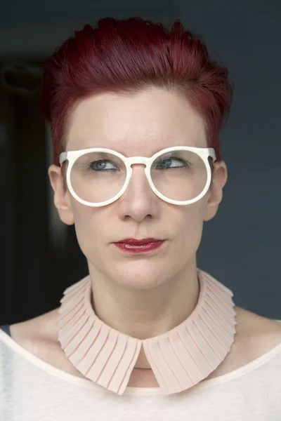 Portrait of red-haired woman looking to the side — Stock Photo, Image