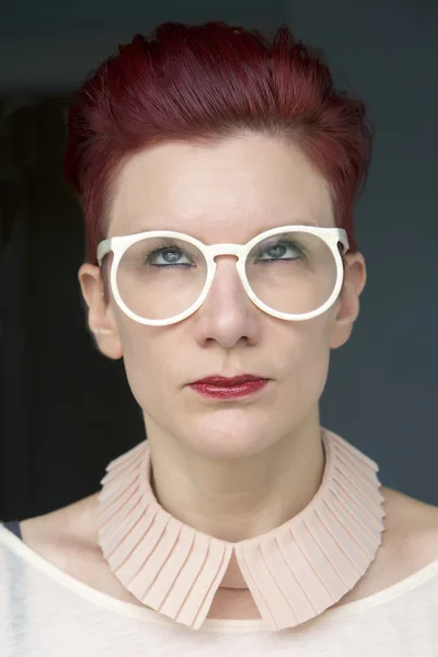 Portrait of red-haired woman looking up — Stock Photo, Image