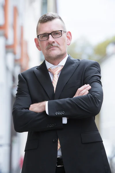 Portrait of businessman standing in the street — Stock Photo, Image