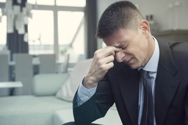 işadamı bir baş ağrısı ile