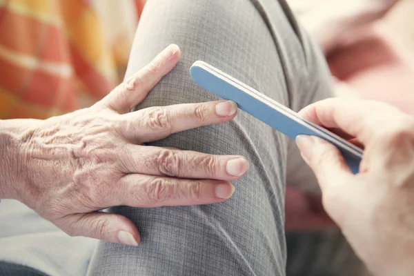 Closeup of woman's hand with nailfile — Stock Photo, Image