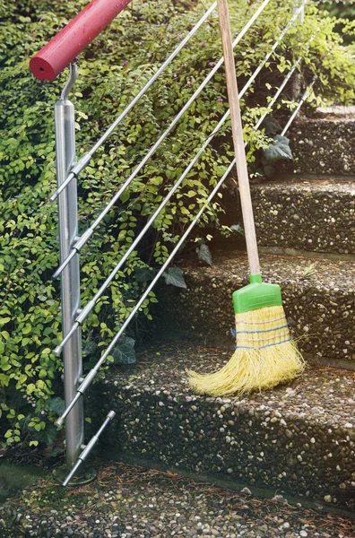 Broom outside on stairs — Stock Photo, Image