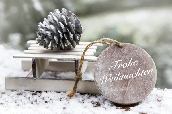 Miniaturschlitten mit "frohe Weihnachten" — Stockfoto