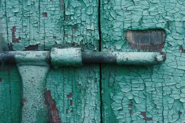 Eski boyanın ahşap ve metal üzerindeki dokusu.