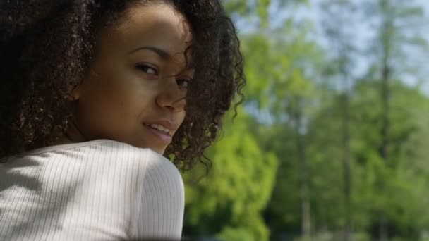 Closeup portrait of a beautiful mixed race woman smiling warmly to a camera. — Stock Video