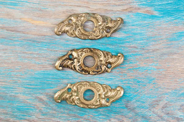 Three Old Bronze Handle Hole Covers Shabby Wooden Background Copy Stock Picture