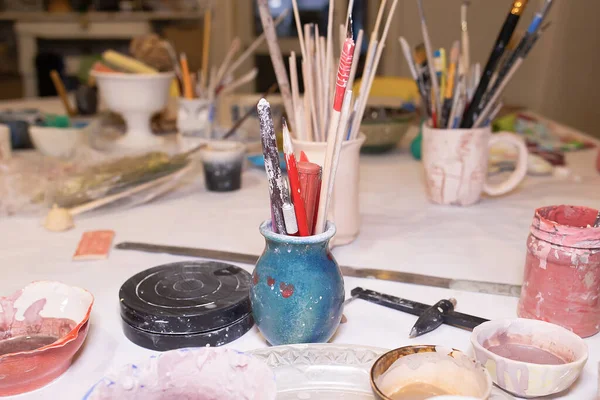 Working table of an art pottery workshop. Art school. Children\'s animation.