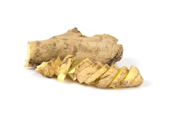 Sliced up ginger on white background — Stock Photo, Image