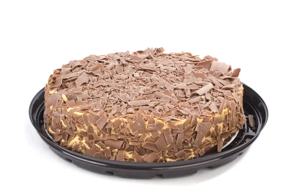 白いプラスチックの皿とチョコレート クリーム ケーキ — ストック写真