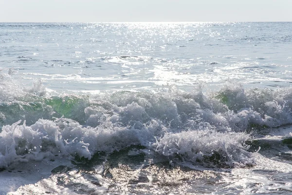 Sand sea beach and blue sky after sunrise and splash of seawater — Stock Photo, Image