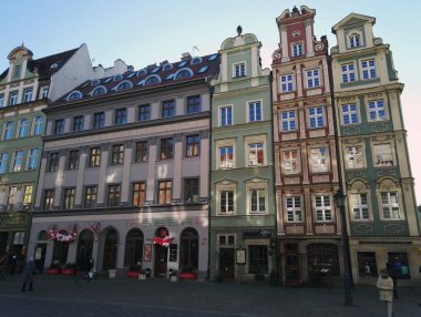 Wroclaw, Poland - December 29, 2017: Colorful buildings on Wroclaw old town with tourists and people walking on the streets. Cityscape in western Poland and historical capital of Silesia