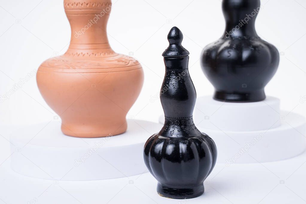 Labu Sayong / Sayung is a traditional Malaysian handcrafted pottery made of clay used as a water container, isolated on white background.