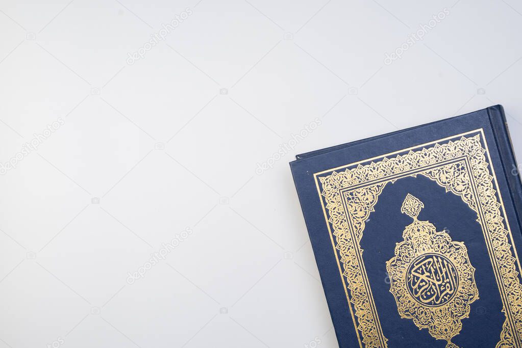 Ramadan Kareem, Eid Mubarak or Islamic concept. The Islamic holy book, Quran or Kuran. Arabic words on the book means 