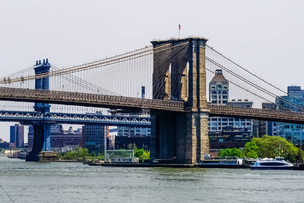 The Brooklyn Bridge is a bridge in New York City, spanning the East River between the boroughs of Manhattan and Brooklyn.