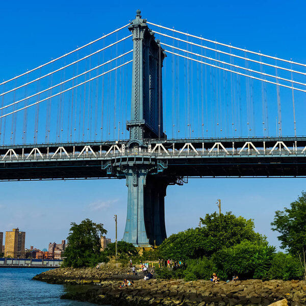 The Manhattan Bridge is a suspension bridge that crosses the East River in New York City, connecting Lower Manhattan at Canal Street with Downtown Brooklyn at the Flatbush Avenue Extension,