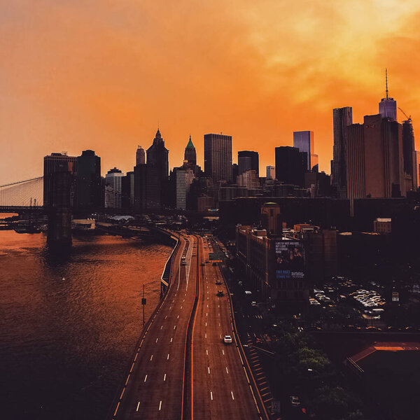 View of Manhattan skyline from the Manhattan Bridge with Manhattan Skyline in the background at sunset. Manhattan, USA